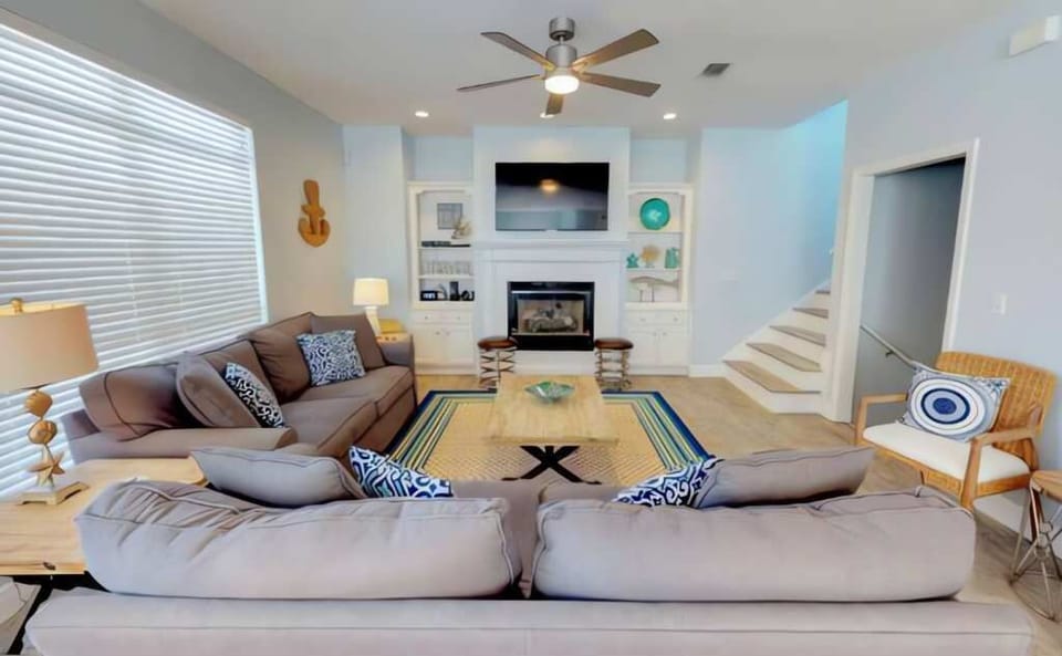 Enjoy resting in the spacious living room with an indoor fireplace during the winter. 