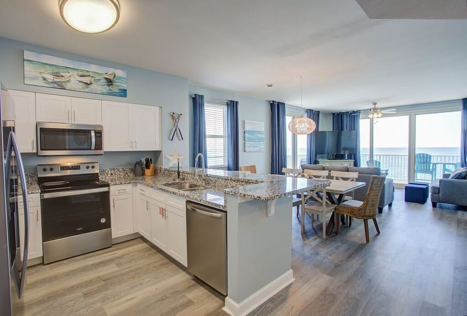 Stainless Steel Appliances, Granite Counters and White Cabinetry
