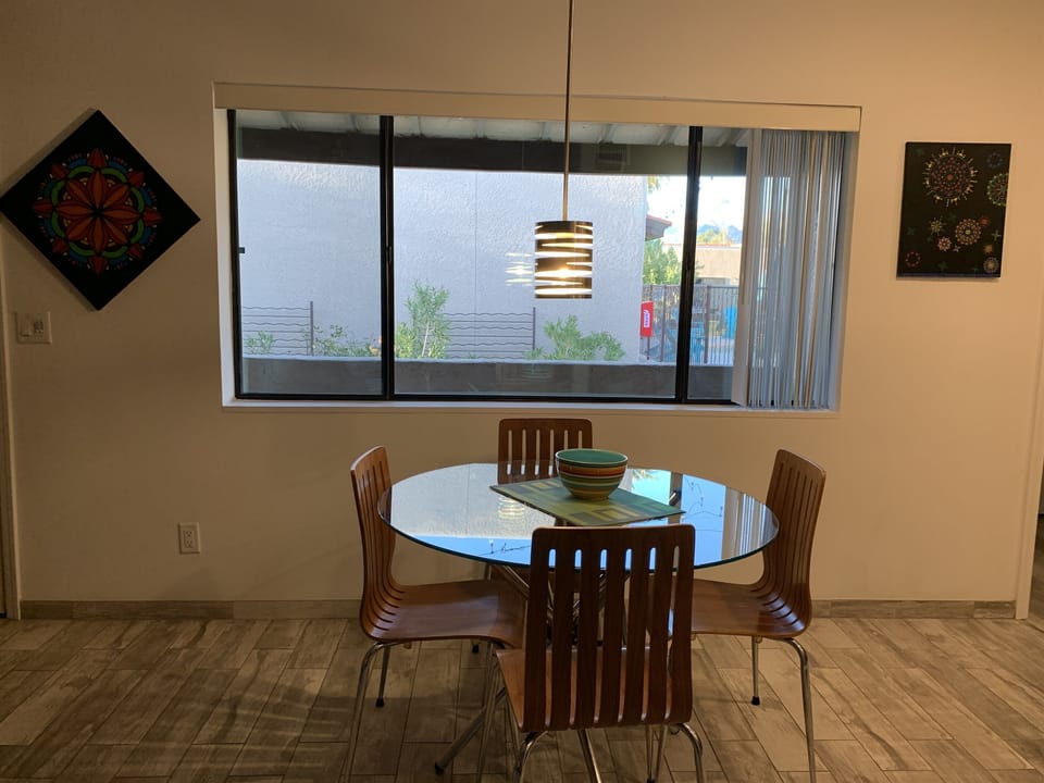 Dining area with view of pool.