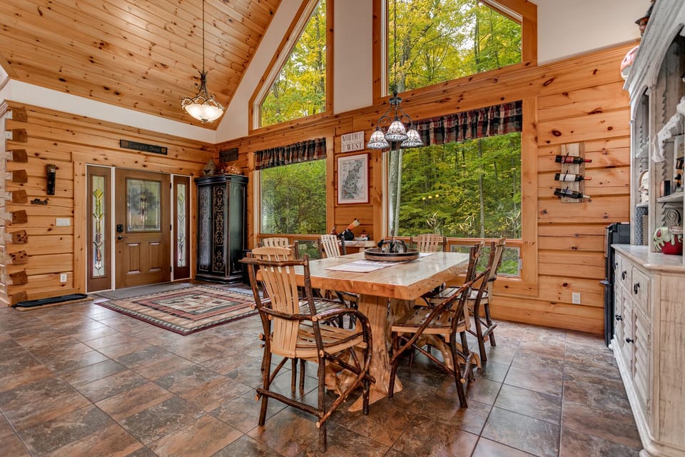 Another shot of the open concept and massive windows providing a scenic view.