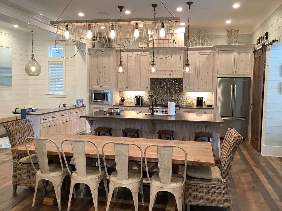 Light, airy kitchen and dining room with a table that seats 10