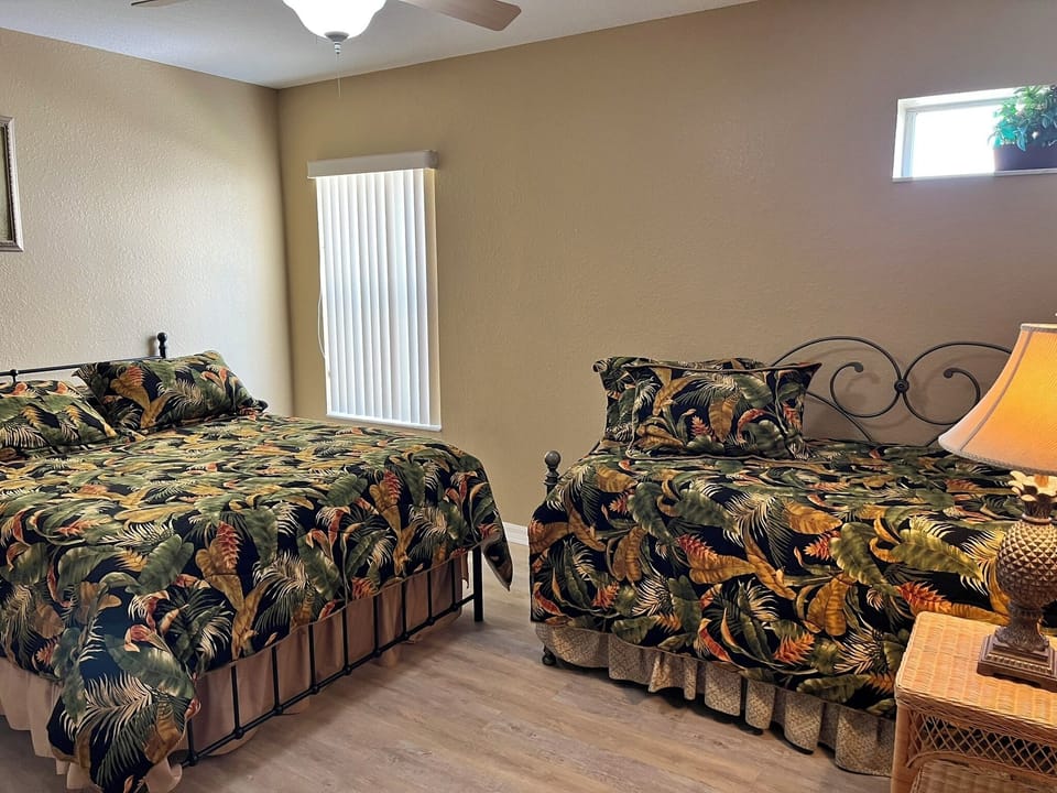2nd bedroom view of Queen and trundle beds
