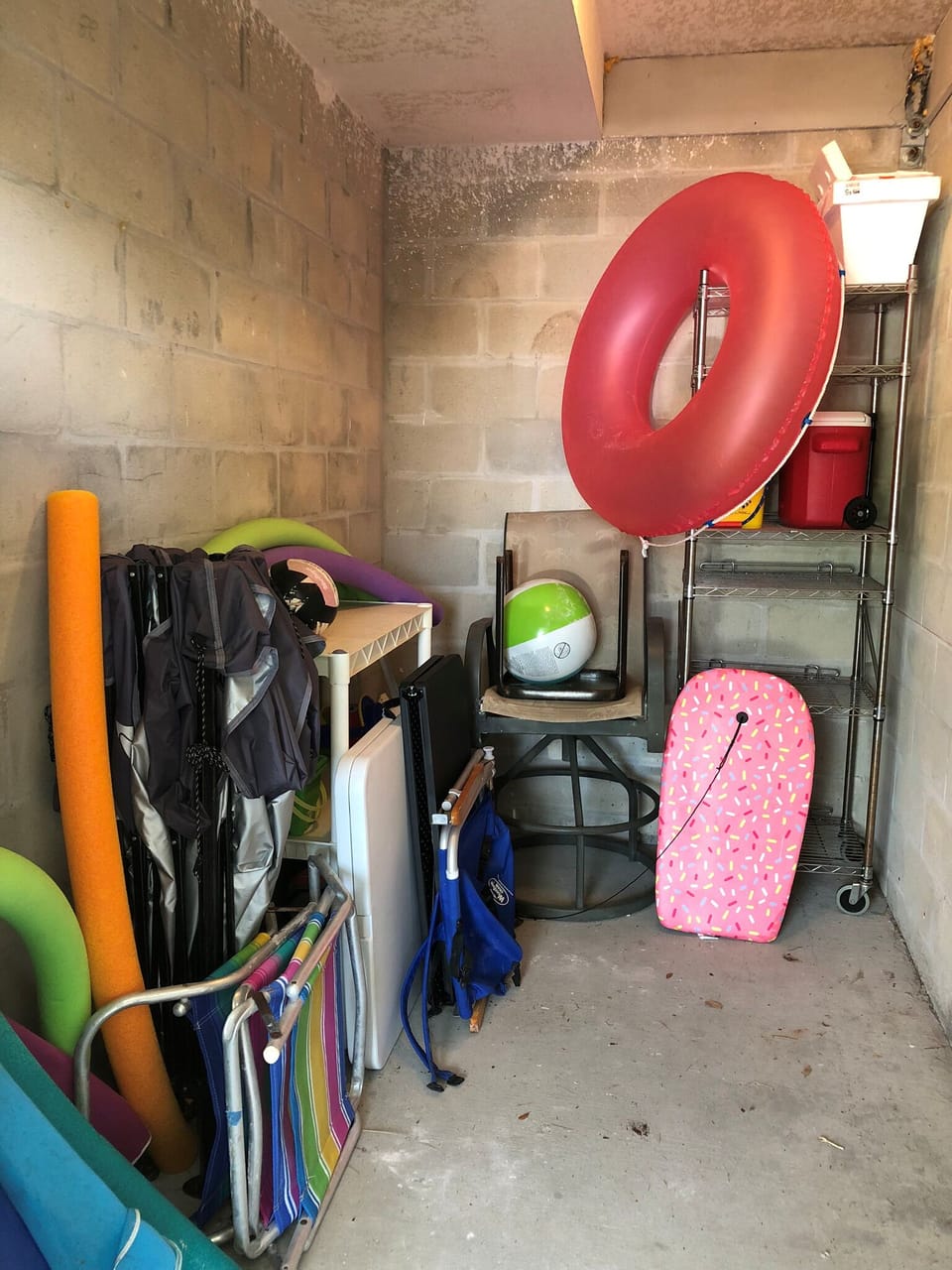 Storage Unit with beach supplies.  Umbrellas, chairs, toys