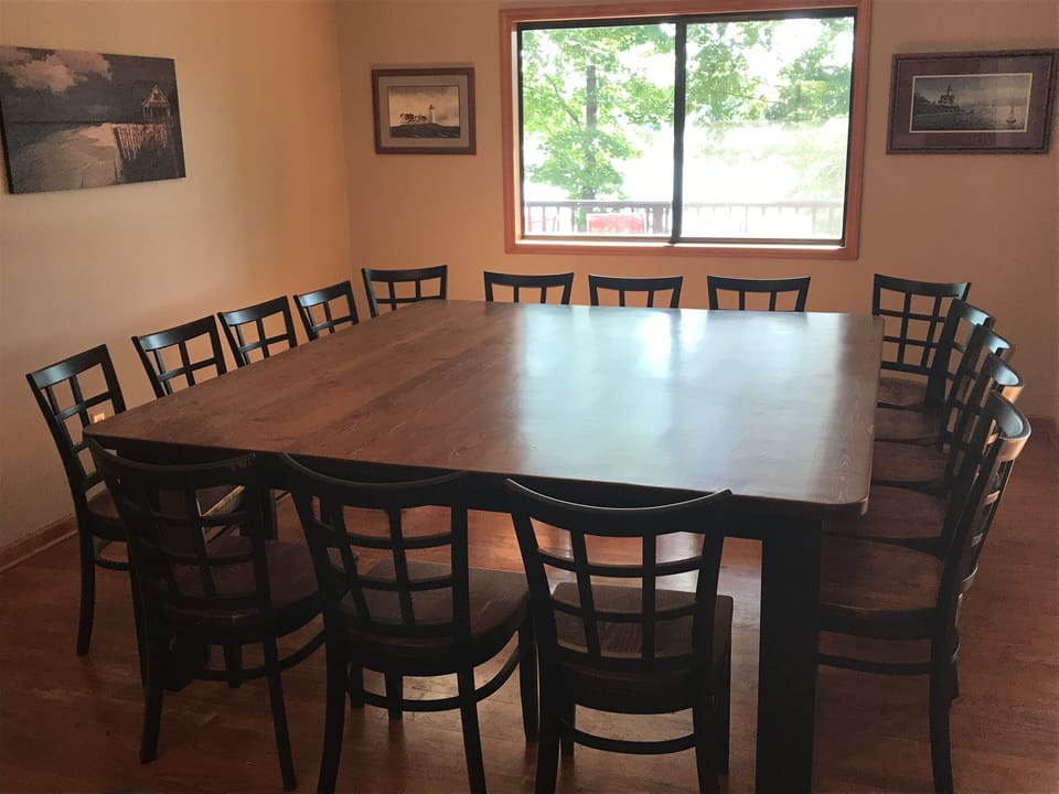 Custom-made dining room table with 16 chairs