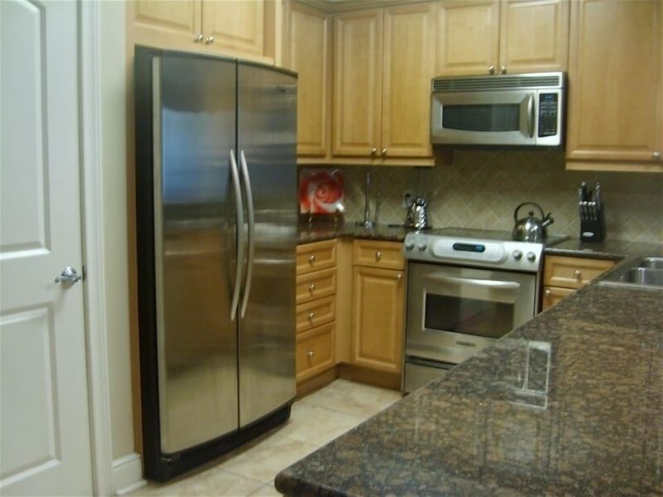 Fully Equipped Kitchen with State of the Art Appliances and Upgraded Cabinetry.