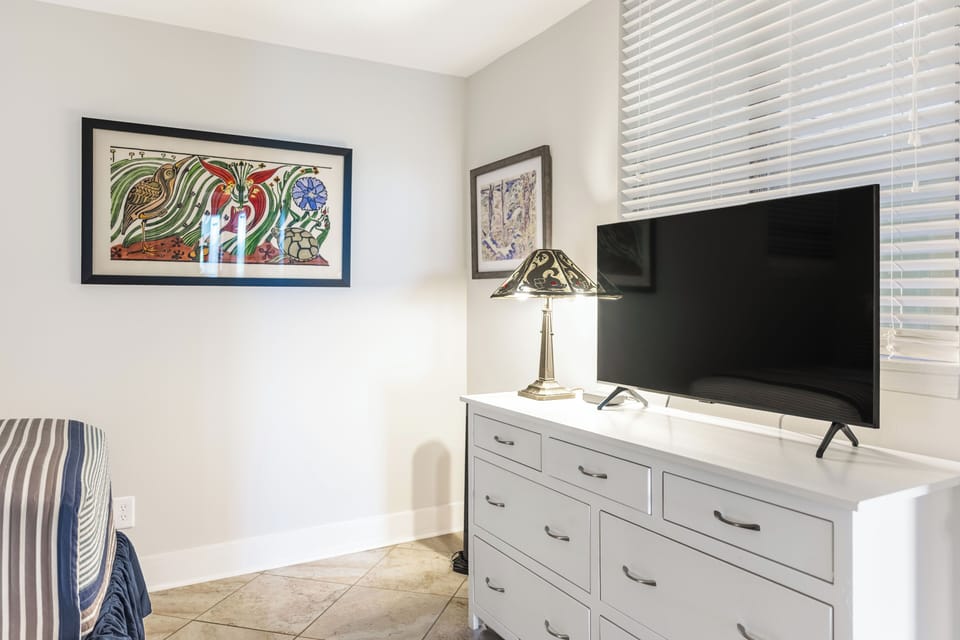 The guest bedroom has an HD TV