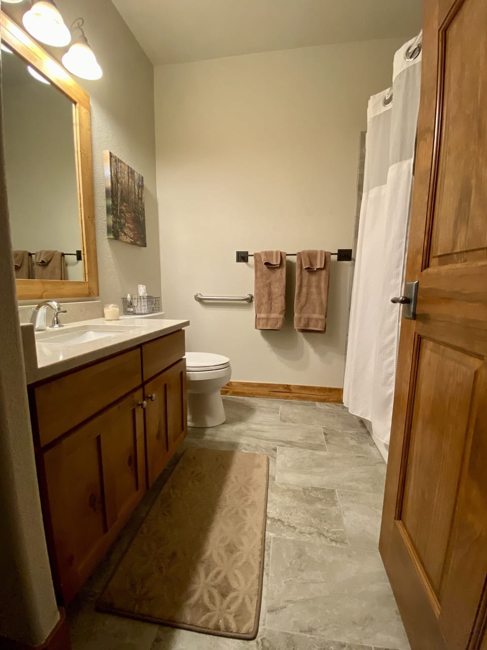 Newly-renovated guest bathroom, which has bath and toilet handrails. 