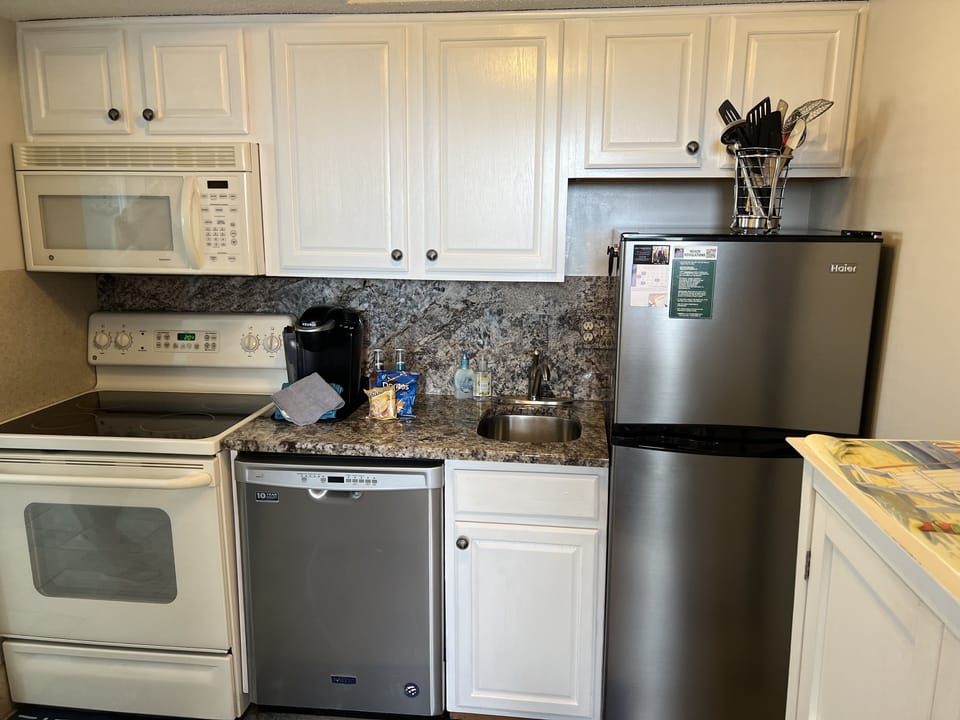 Kitchen with Refrigerator, Stove, Microwave, and Dishwasher
