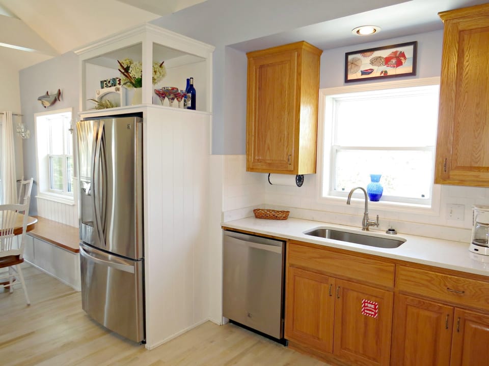Kitchen open to dining. Bright & Airy!