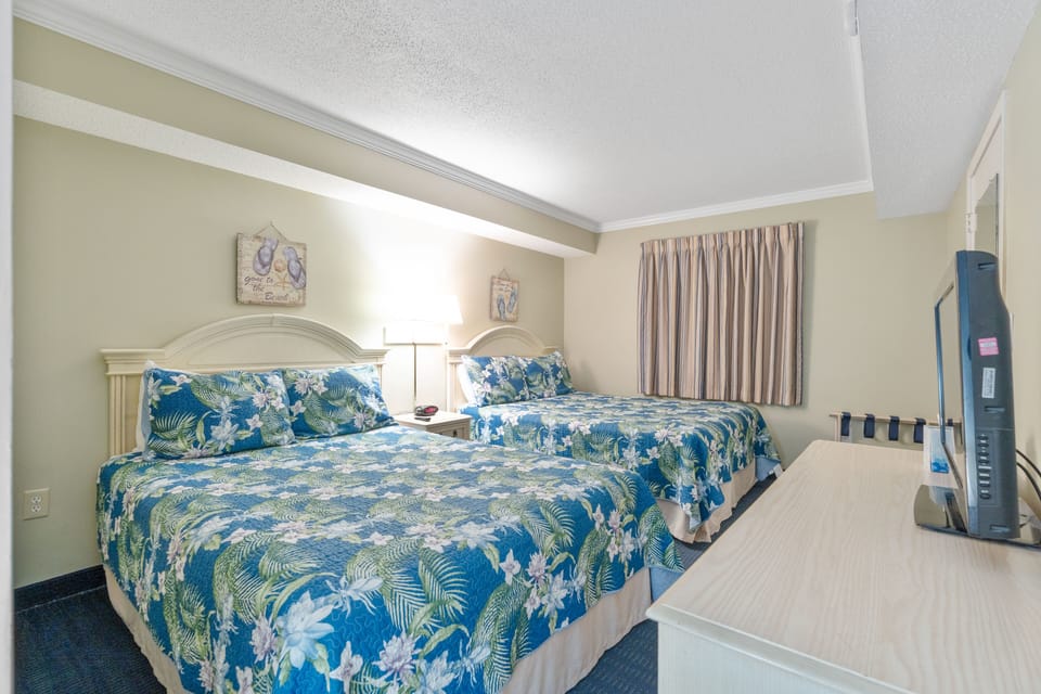 Large guest bedroom with 2 queen beds and flat screen TV