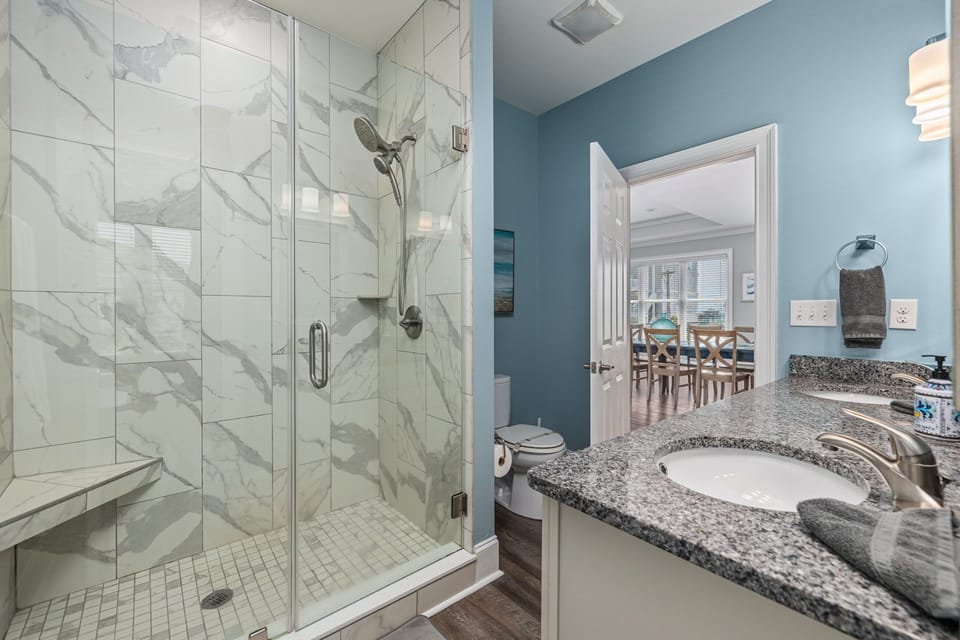 #6 Bathroom - Kitchen level King Bedroom. Beautiful tiled showers. 
