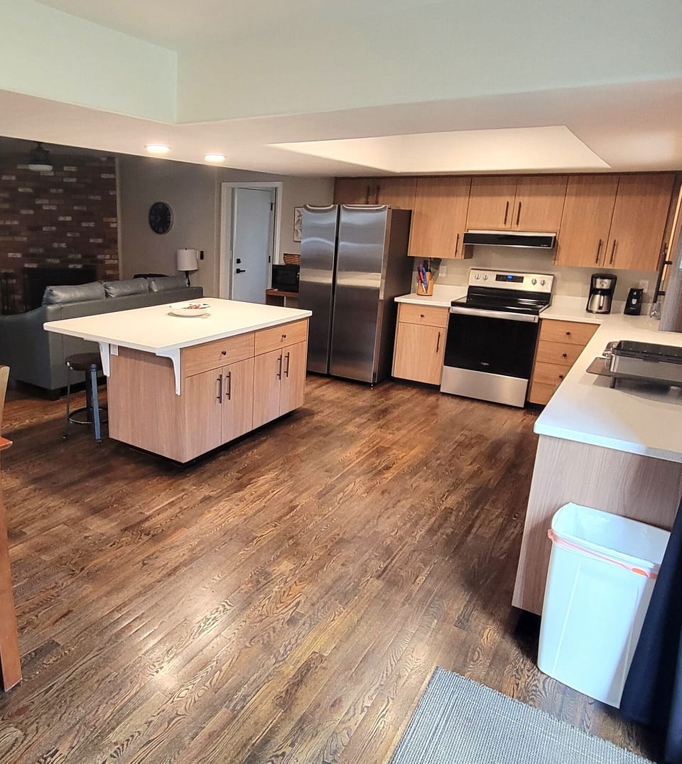 Full kitchen (stocked w/ pots, pans, dishes, silverware, etc.) with a dishwasher