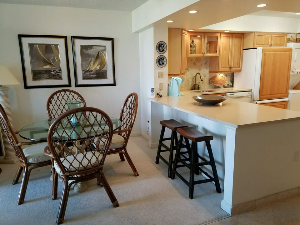 Open kitchen with bar and dining area