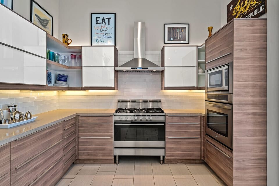 Chef`s Kitchen with Stainless Appliances and Full Prep Space