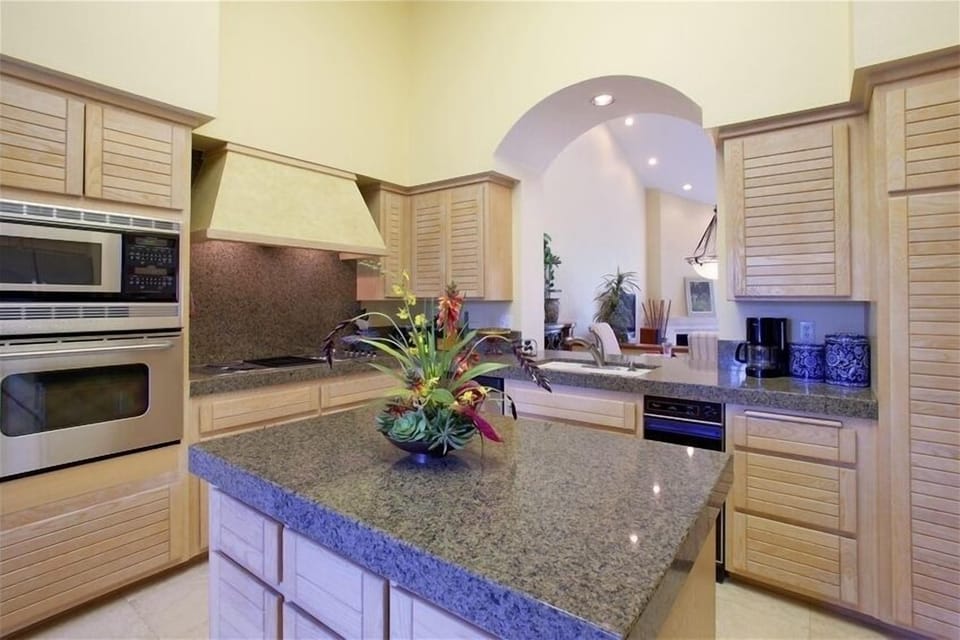 Re-modeled granite kitchen with pass- through to dining room.
