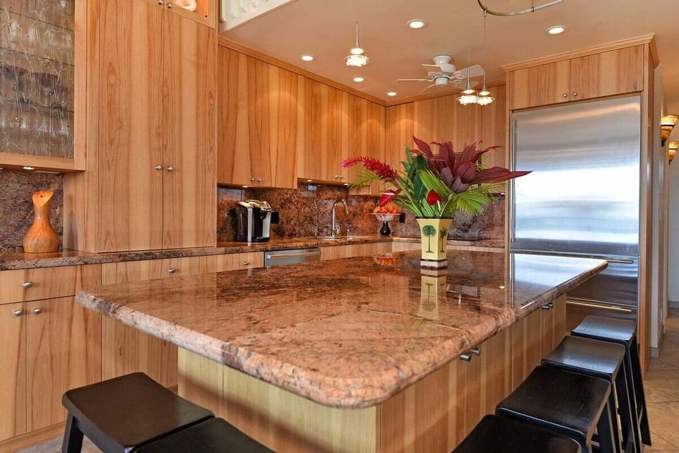 Cook in a modern kitchen accented with tropical details.