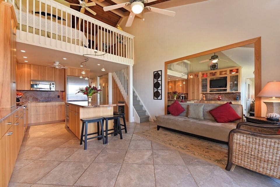 Gather in a spacious living room with vaulted charm.