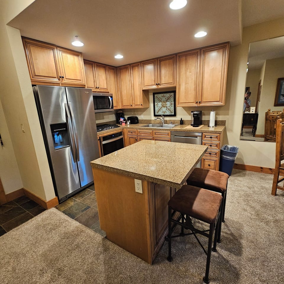 Well equipped kitchen with island. 