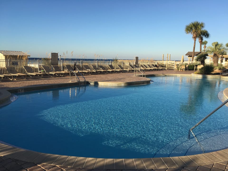 The 86-degree  pool overlooks the Gulf, for comfortable swimming year-round.