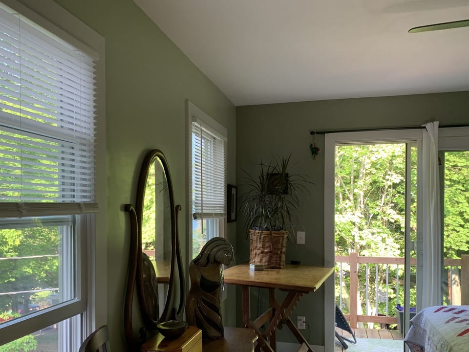 Master bedroom with view of deck