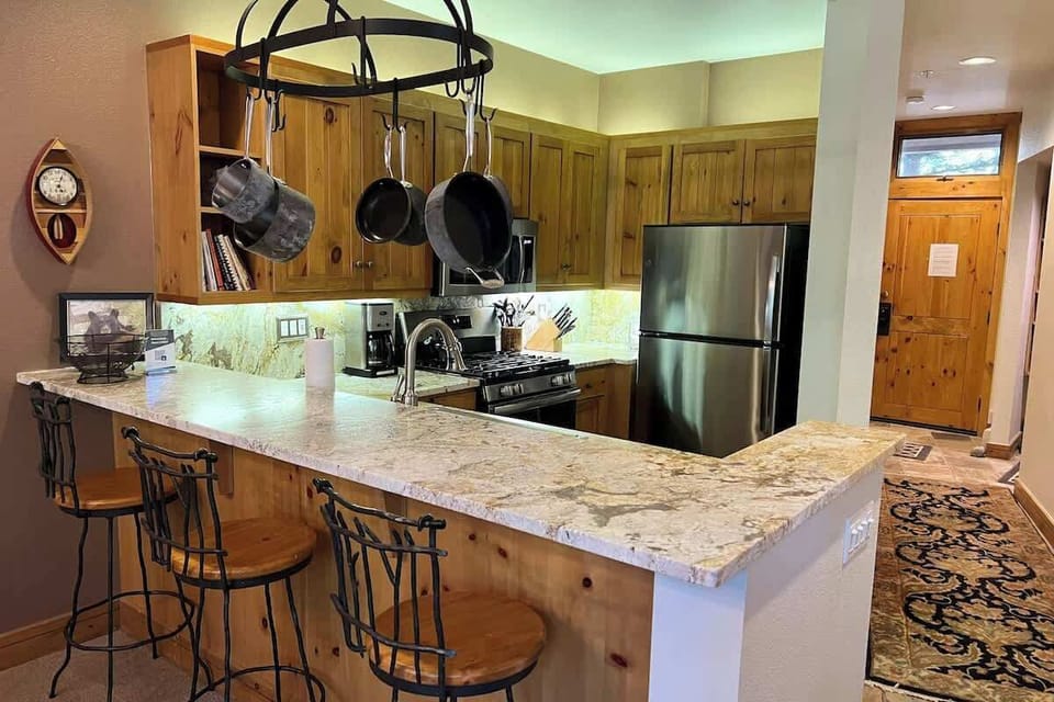 Updated Kitchen with Granite and Stainless Appliances and Gas Stove