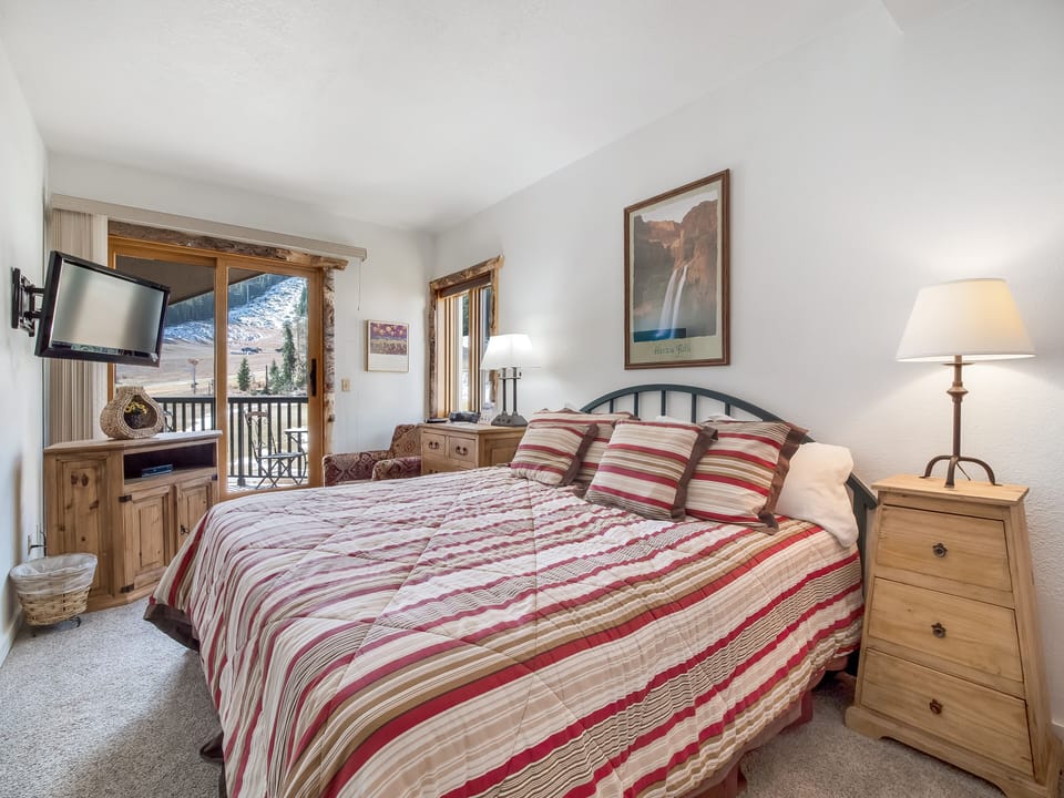 First floor king bed master suit with private balcony, flat screen T.V. and DVD