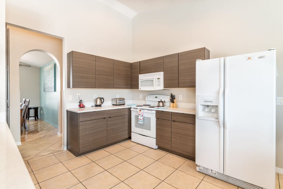  A fully equipped kitchen, complete with a cozy dining nook for memorable meals.