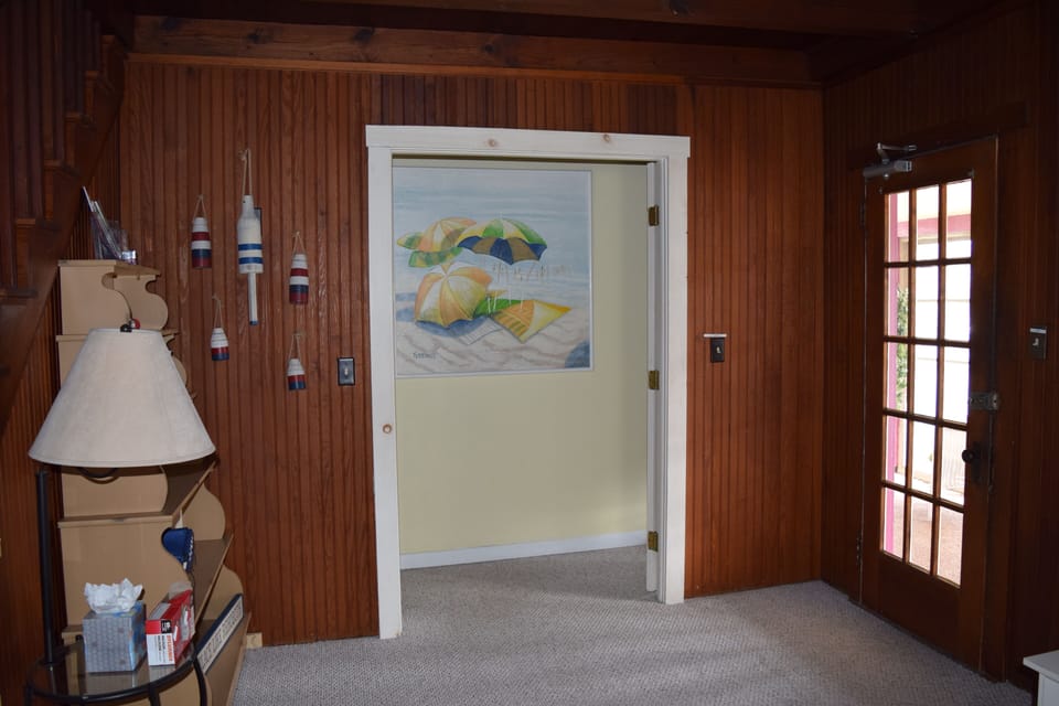 Hallway off living room leads to 3 bedrooms.