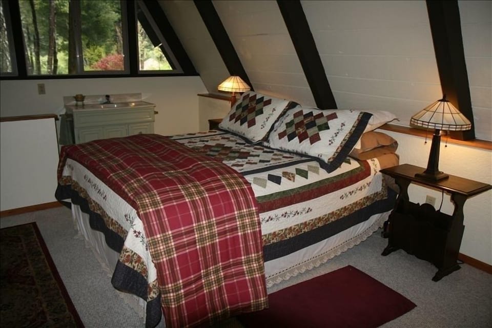 The bedroom and half bath in upstairs loft.