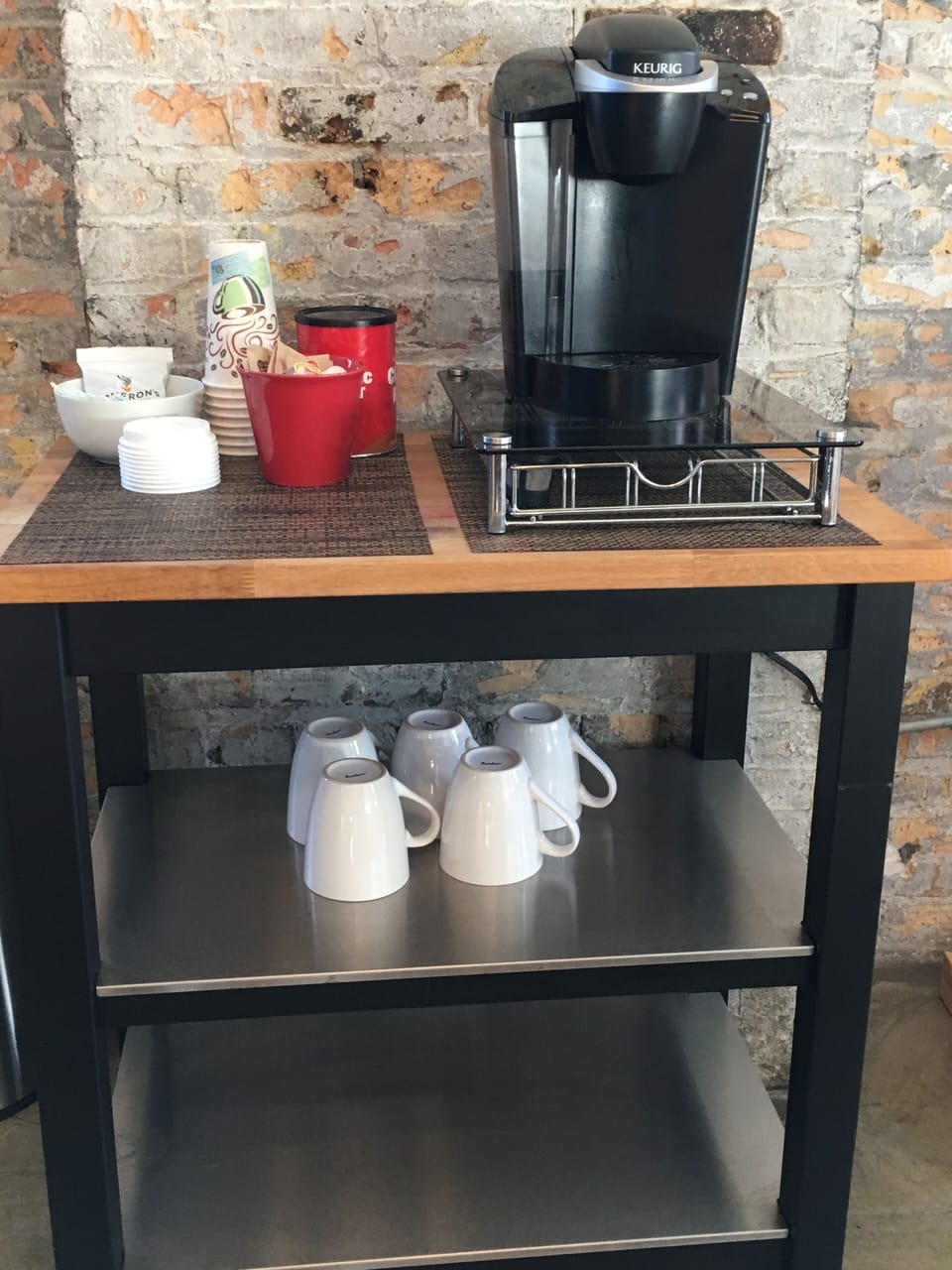 Keurig Coffee Machine, coffee, cups, cream & sugar provided