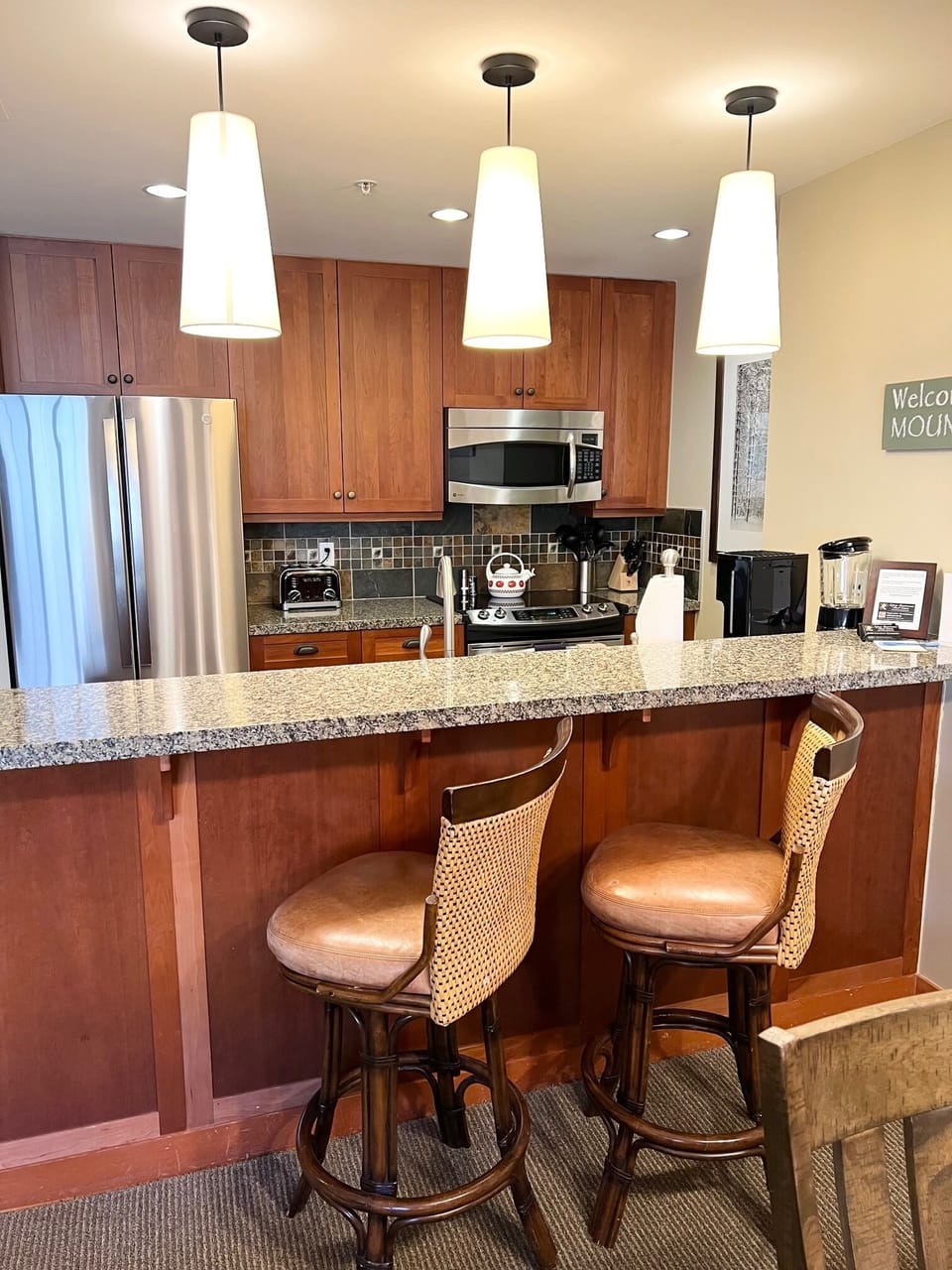 Kitchen with fridge new Fall 2022, stainless steel range, dishwasher, microwave