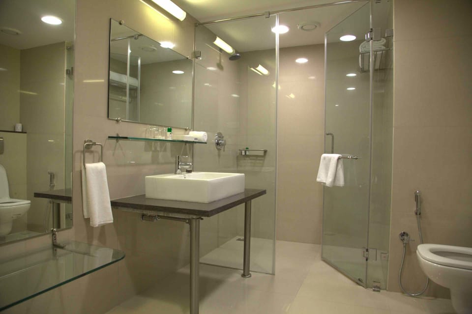 Shower, slippers, bidet, towels