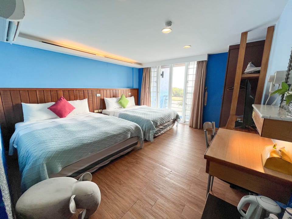 Deluxe Quadruple Room, Ocean View | Desk, blackout drapes, free WiFi, bed sheets