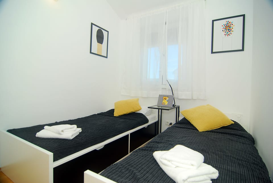 Apartment, Sea View | 2 bedrooms, desk, soundproofing, iron/ironing board