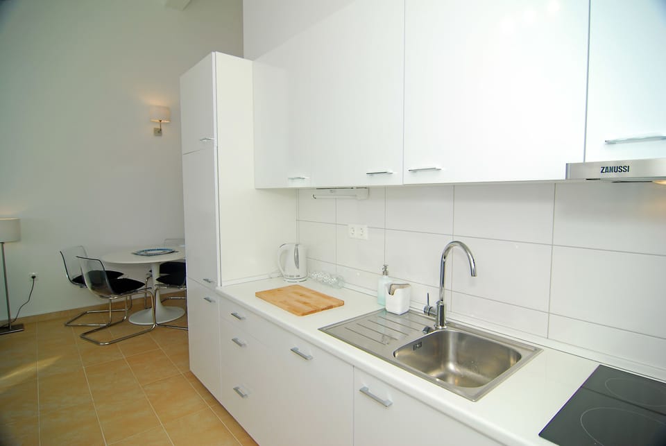 Apartment, Sea View | Private kitchen | Fridge, coffee/tea maker, electric kettle, cleaning supplies