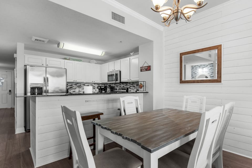 Dining Area - Enjoy memorable meals in this chic dining space for four, where every bite comes with breathtaking beach scenery just beyond the windows.