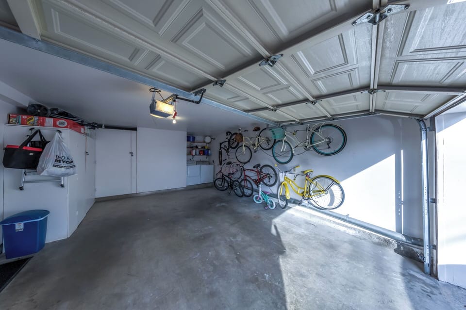 Garage with full size washer/dryer,beach toys, chairs,boogie boards & umbrellas