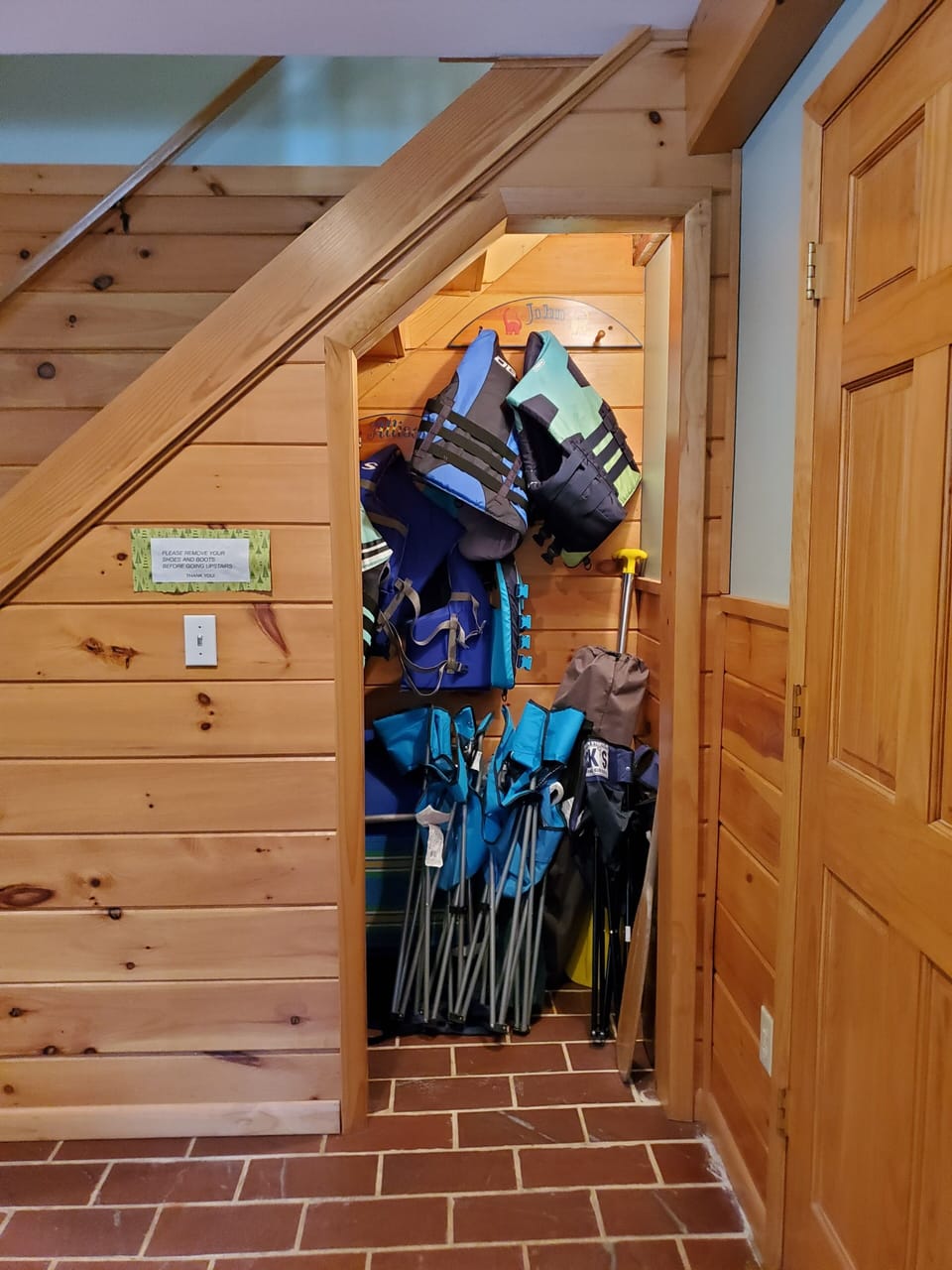 Life vest, boat cushions, canoe paddles, and canvas chairs