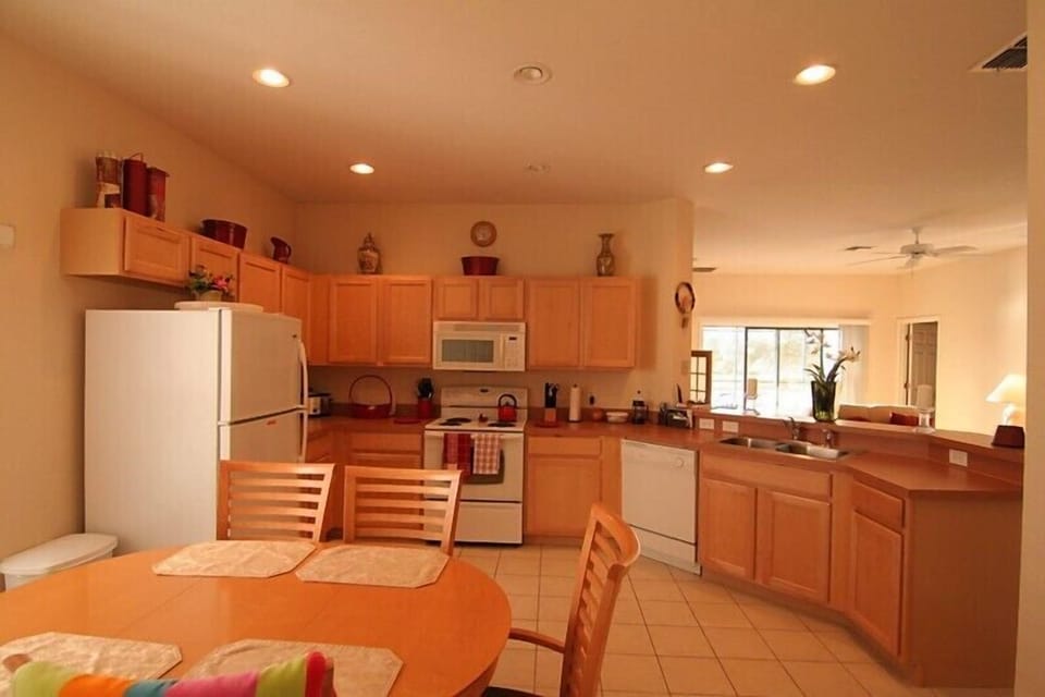 Huge kitchen, open bar and dinning table.