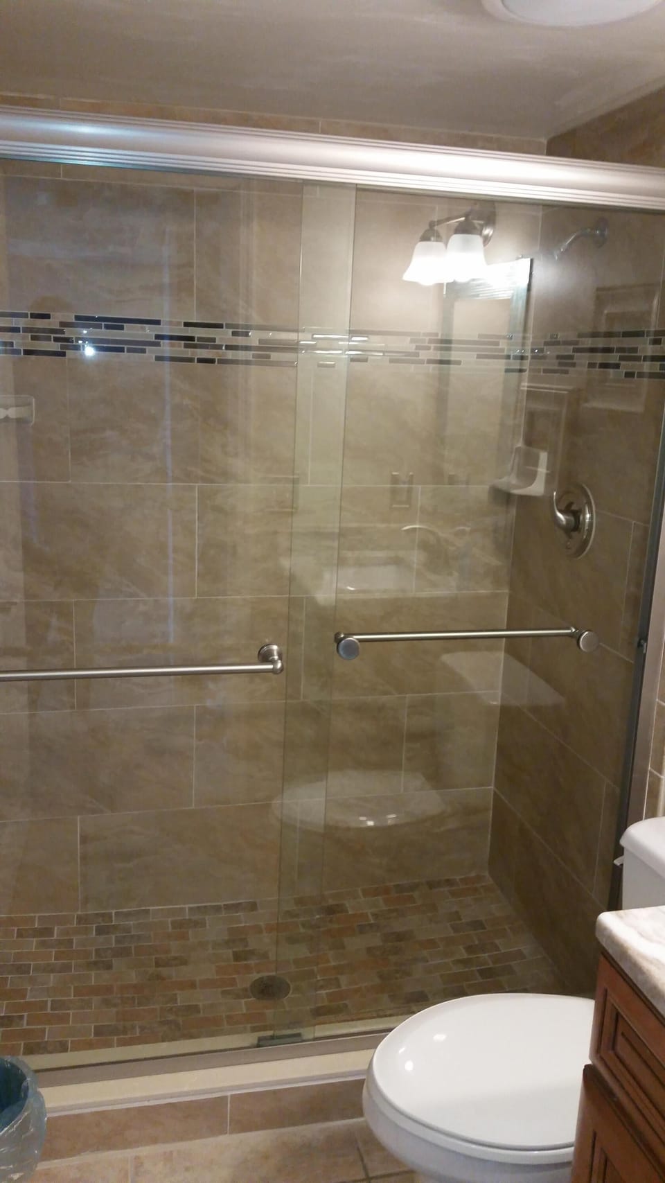 New Tiled and Mosaic Shower with Glass Enclosed Door