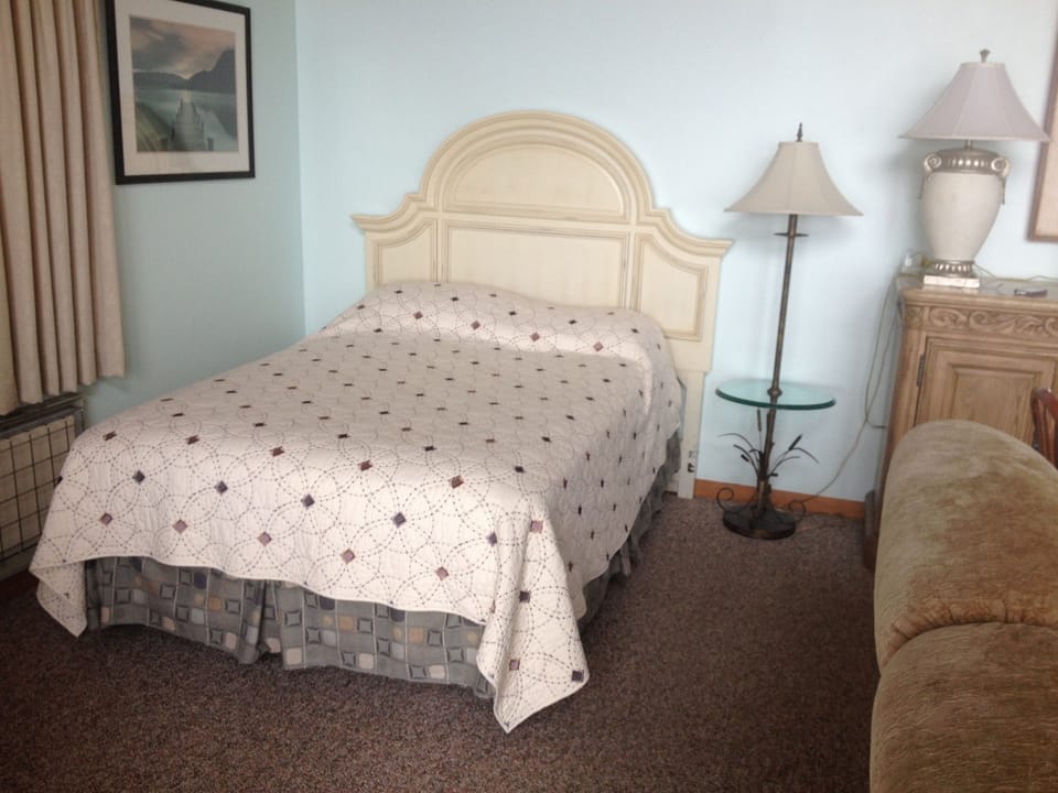 Full size bed in the living room