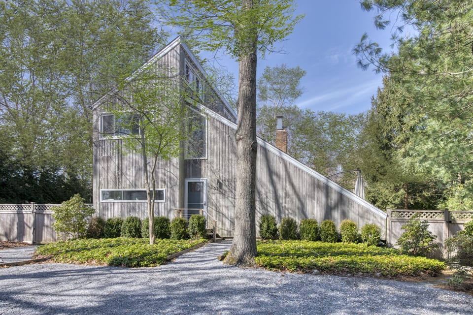 Contemporary salt box on half acre
