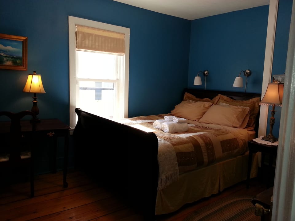 Master bedroom with Queen sleigh bed and twin reading lamps over bed.  2nd floor