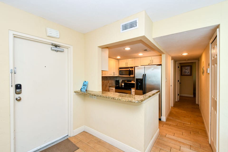 Modern, fully equipped kitchen with granite counters and all stainless appliances