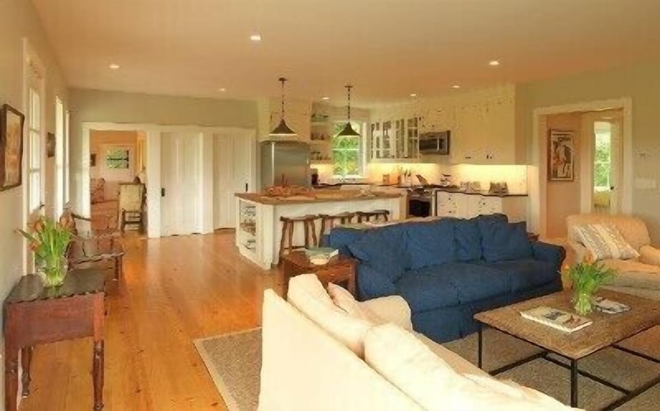 Family Room and Kitchen with Floor to Ceiling Stone Fireplace