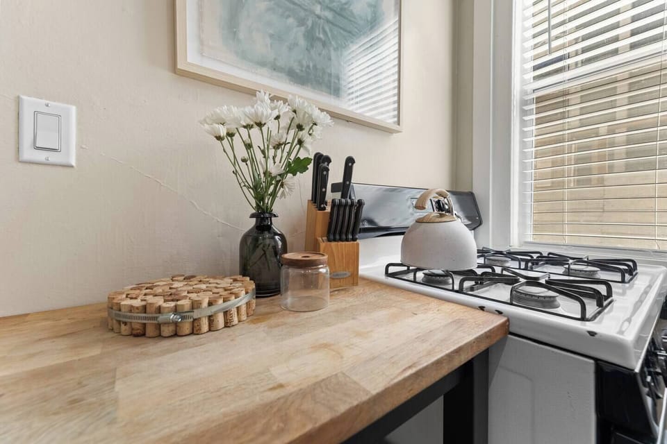 Cook up something amazing! Our fully equipped stove makes it easy to whip up your favorite meals in this cozy kitchen.