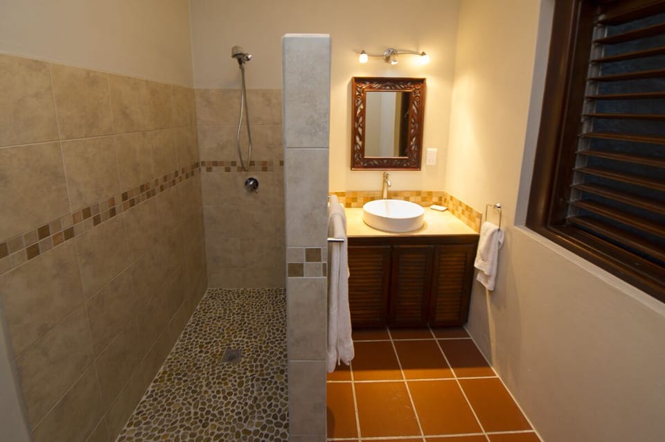 One of 2 bathrooms in the pool level unit