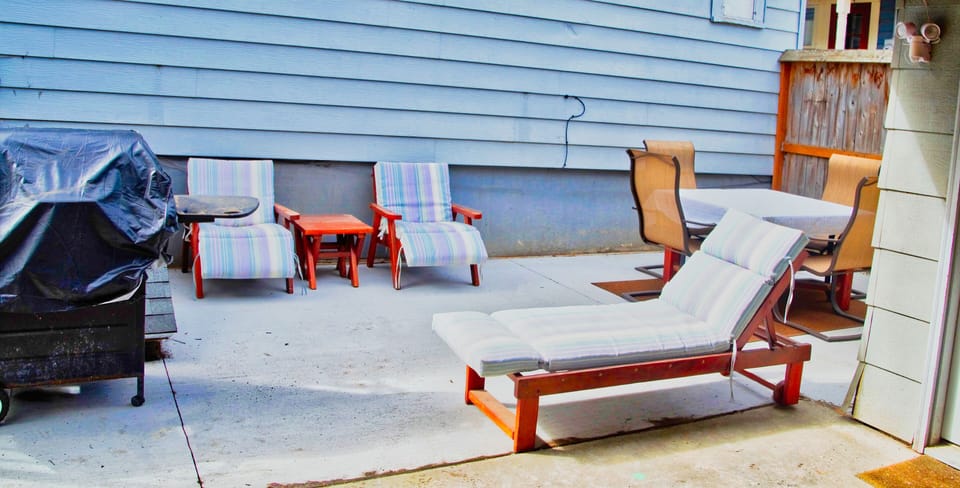 Backyard patio with seating and gas BBQ