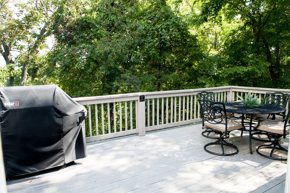  Large top deck off dinning room with 3 burner Weber grill.Table seats 4 guest.