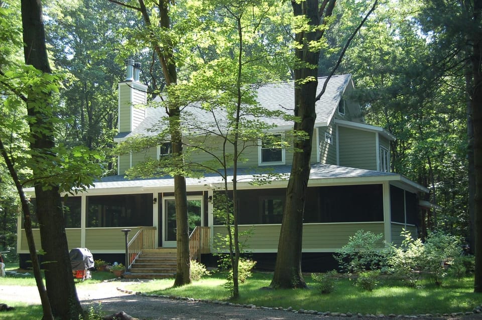 Huge screened in wrap-around porch for plenty of family fun! 